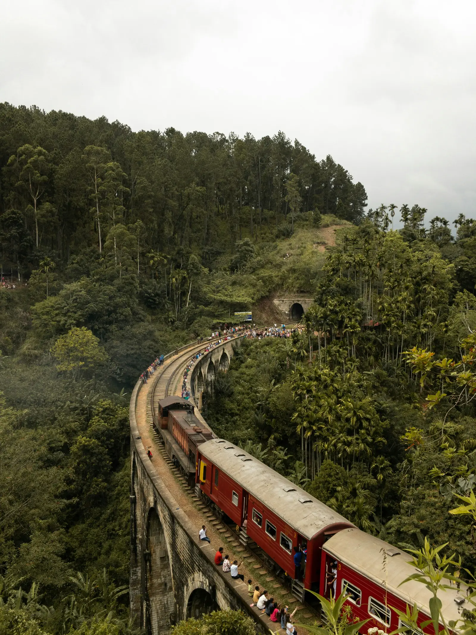 Red train on Nine Arch Bridge