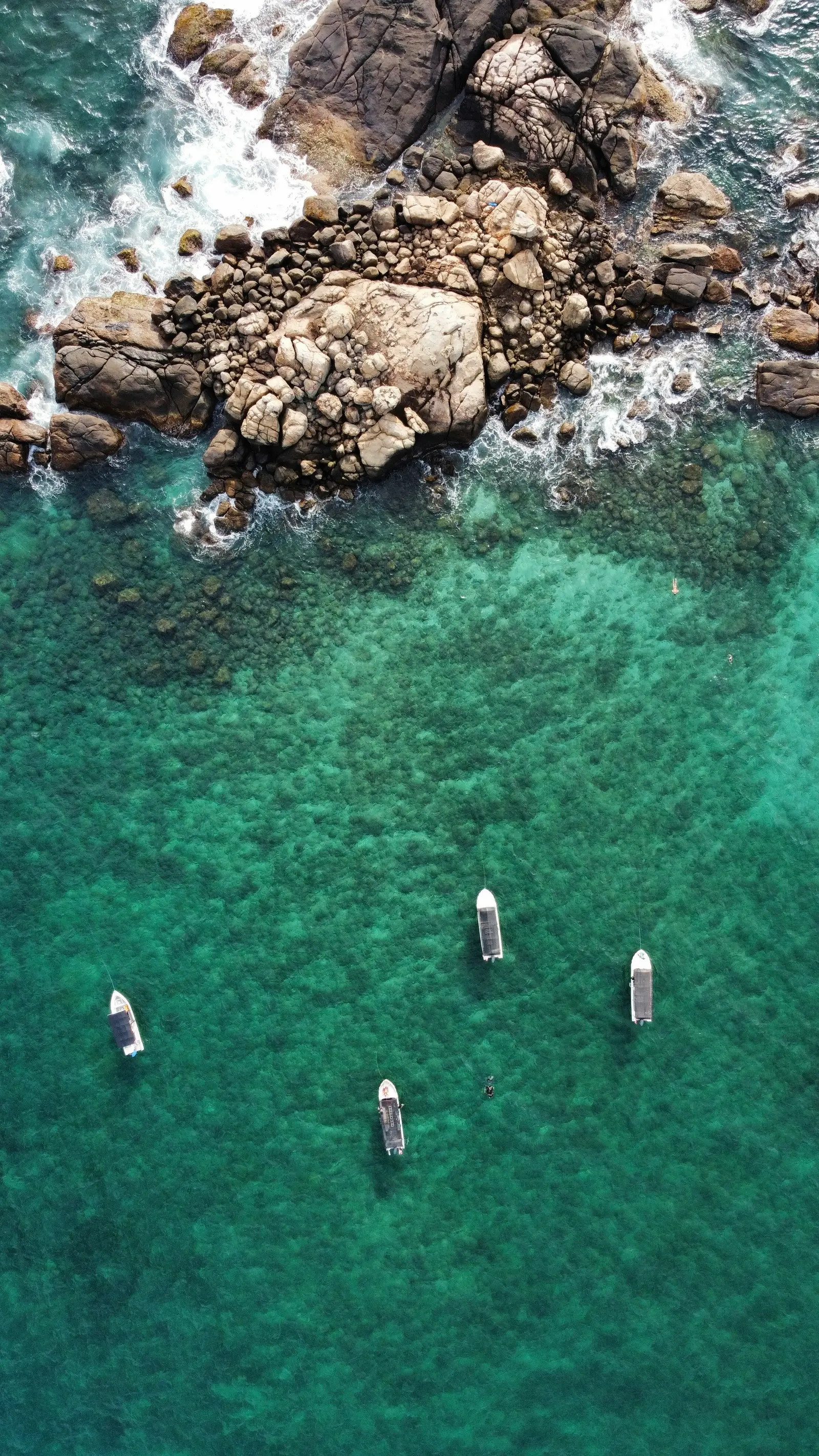 Aerial view of turquoise waters and boats near Pigeon Island, Trincomalee