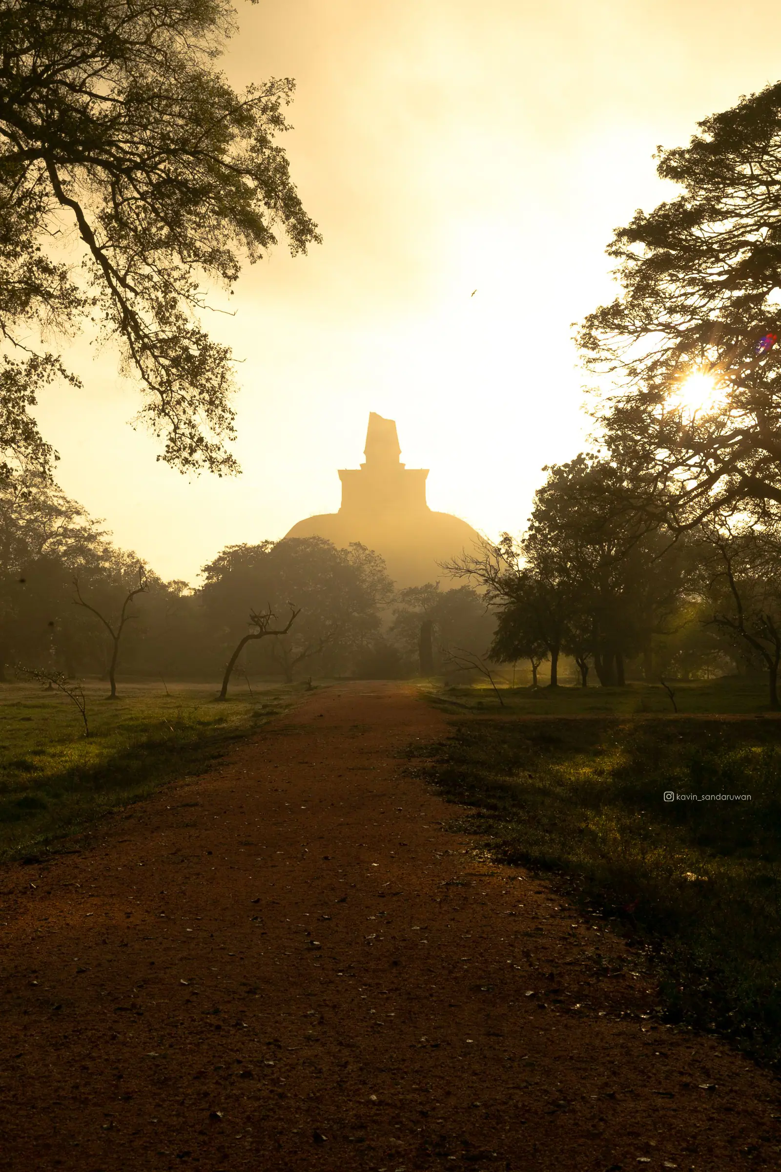 An ancient Sri Lankan monument glowing at sunrise